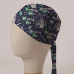 Breaking Gas scrub cap: Breaking Gas element tiles with anaesthetic machines and breathing bags on navy