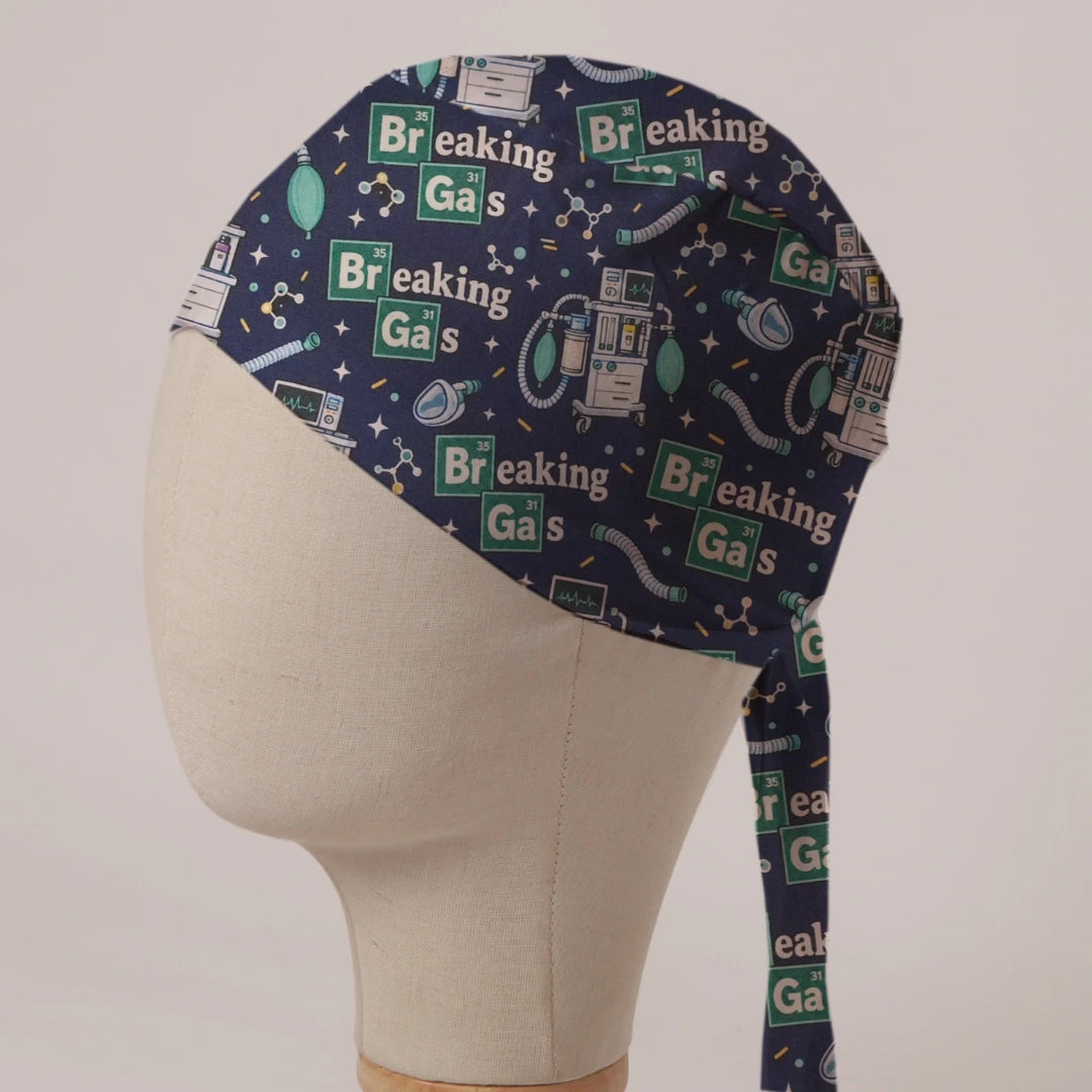 Breaking Gas scrub cap: Breaking Gas element tiles with anaesthetic machines and breathing bags on navy