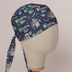 Breaking Gas scrub cap in Bandana tie-back style on mannequin head, front right view with the Medicus label