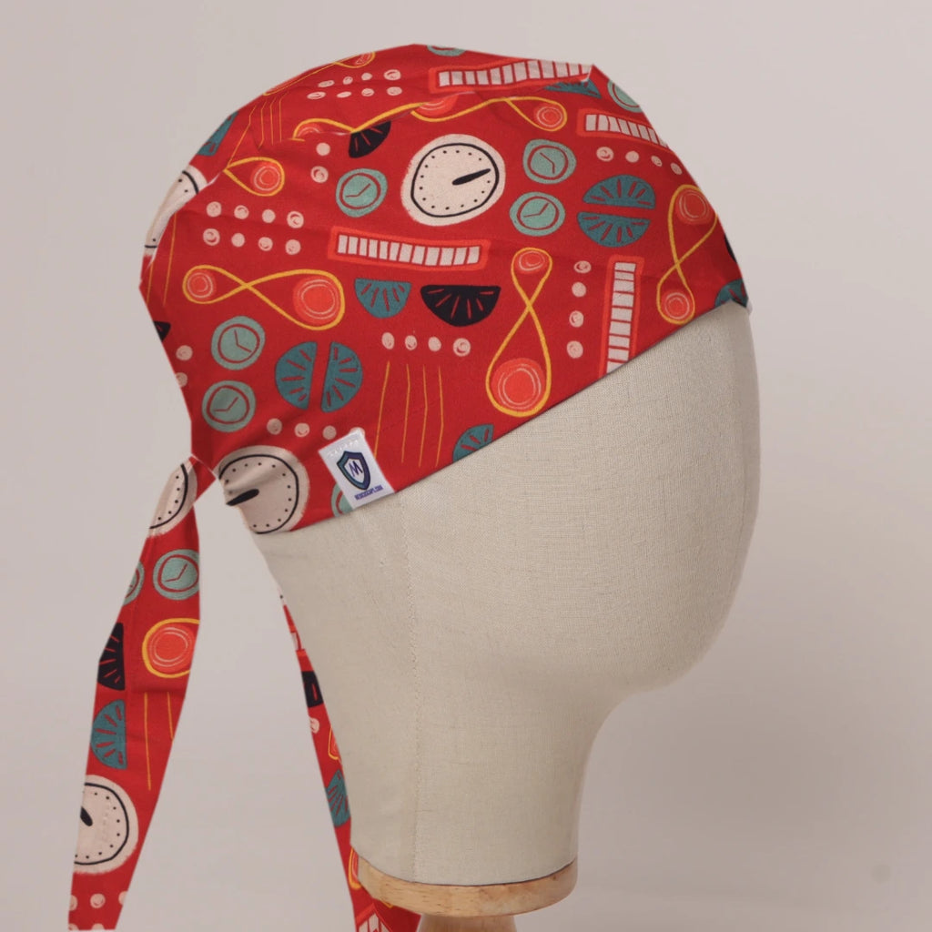 Cartoon Time Machine scrub cap in Bandana tie-back style on mannequin head, front right view with the Medicus label