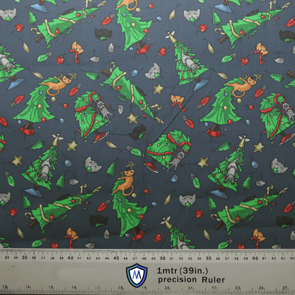 The Medicus Scrub Caps Christmas Cats Ruin Tree scrub cap features a playful holiday design with cartoon kittens climbing decorated Christmas trees on a dark background, showcasing twinkling stars and festive charm, accented by silver bells and red ornaments.