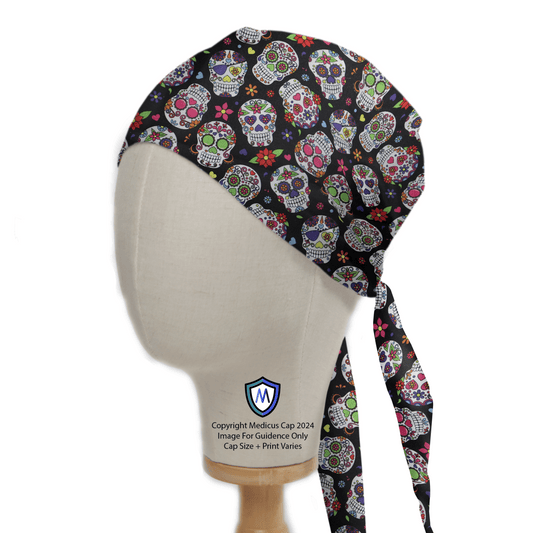 The Cinco De Mayo Skulls Candy Scrub Cap by Medicus Scrub Caps is showcased on a mannequin head, featuring vibrant sugar skull patterns and floral designs. Eco-friendly and perfect for Cinco De Mayo, it includes a unique medical emblem on the side.