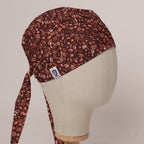 Coffee Beans scrub cap in Bandana tie-back style on mannequin head, front right view with the Medicus label