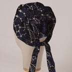 Constellations Stars scrub cap in Bandana tie-back style on mannequin head, back view with ties