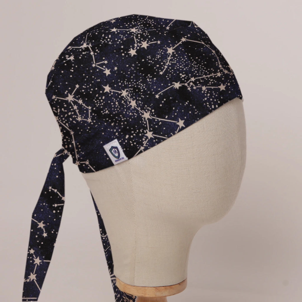 Constellations Stars scrub cap in Bandana tie-back style on mannequin head, front right view with the Medicus label