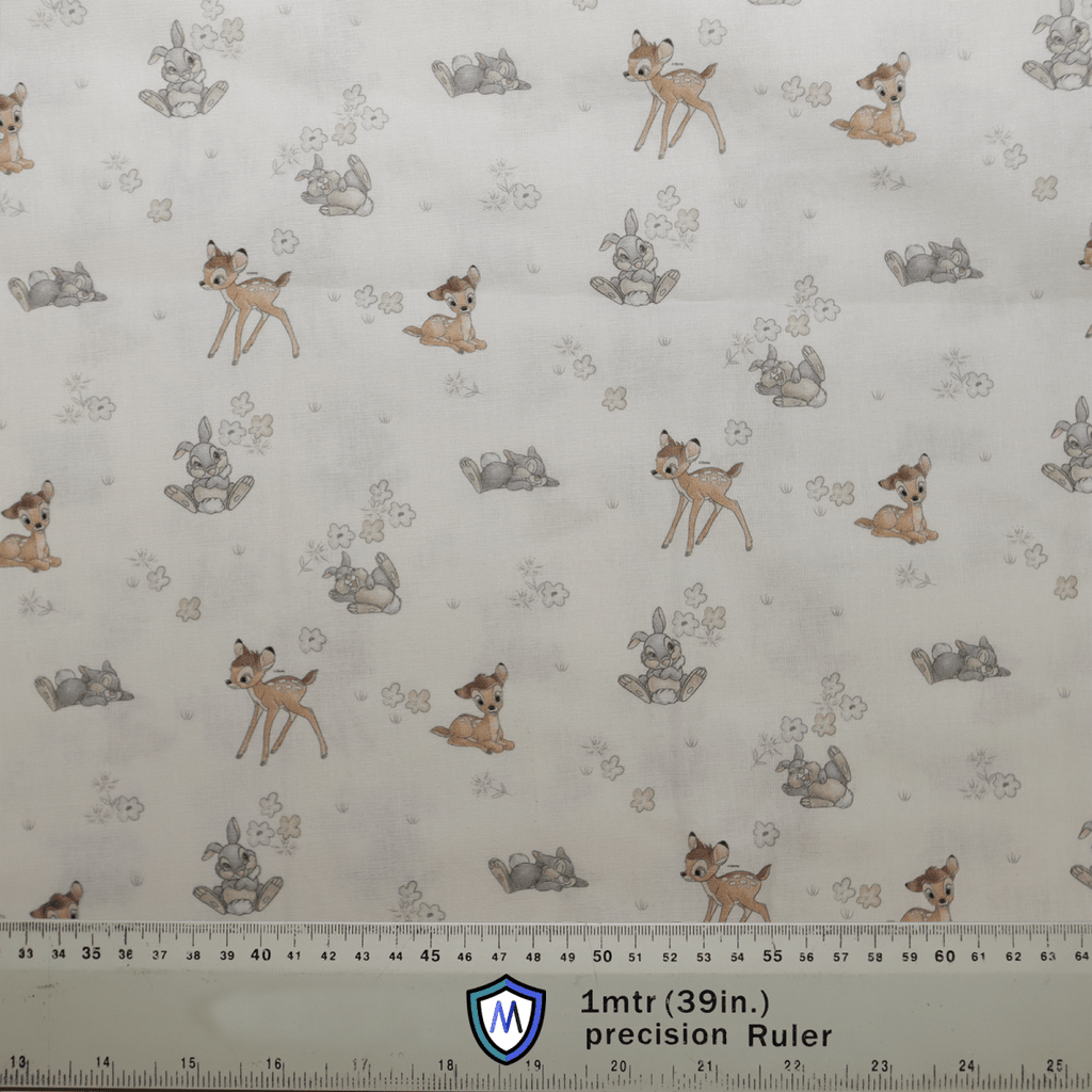The Disney Bambi Small On Ice With Thumper fabric by Medicus Scrub Caps features playful fawns and rabbits with leaf motifs, perfect for adding whimsy to a scrub cap. It includes a 1mtr (39 in.) precision Ruler on a light neutral background for precise measuring.