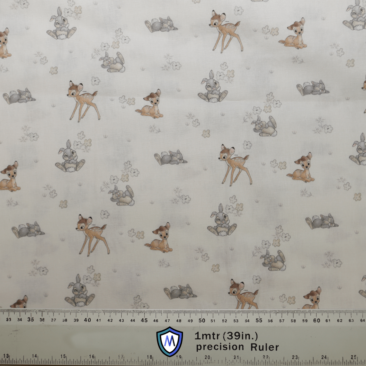 The Disney Bambi Small On Ice With Thumper fabric by Medicus Scrub Caps features playful fawns and rabbits with leaf motifs, perfect for adding whimsy to a scrub cap. It includes a 1mtr (39 in.) precision Ruler on a light neutral background for precise measuring.