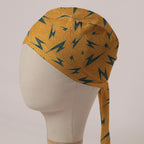 Electric Bolts On Yellow scrub cap in Bandana tie-back style: teal lightning bolts on speckled mustard yellow