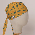 Electric Bolts On Yellow scrub cap in Bandana tie-back style on mannequin head, front right view with the Medicus label