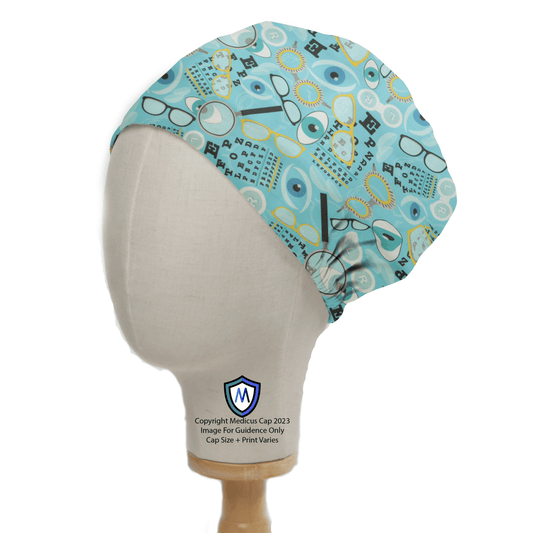 A mannequin head displays the eco-friendly Eye Doctor Mashup Scrub Cap by Medicus Scrub Caps, featuring a whimsical pattern of glasses, eyes, and medical symbols in blue and green shades. Ideal for medical use, it offers personalized embroidery for a unique touch.