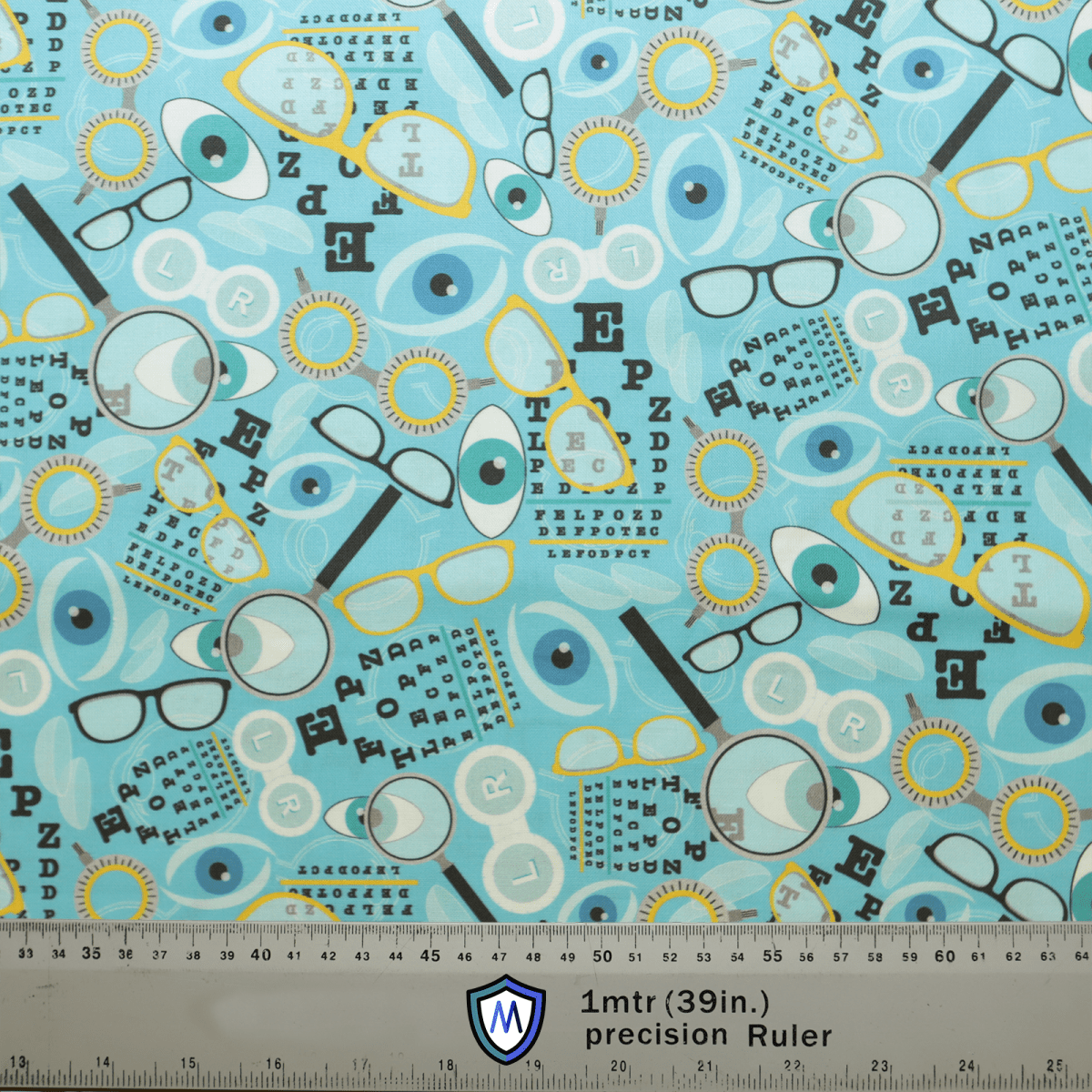 The Eye Doctor Mashup Scrub Cap by Medicus Scrub Caps features eye charts, glasses, eyes, and visual test symbols on a light blue background with an eco-friendly ruler at the bottom showing measurements in metric and inches.