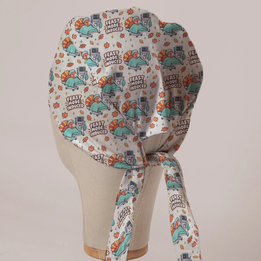 Feast Mode Induced scrub cap in Bandana tie-back style on mannequin head, back view with ties