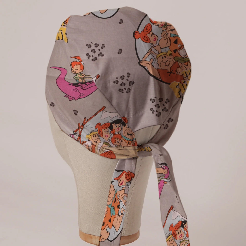 Flintstones in Grey fabric scrub cap in Bandana tie-back style on mannequin head, back view with ties