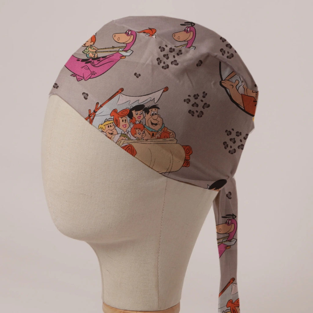 Flintstones in Grey fabric scrub cap in Bandana tie-back style: the Flintstones on stone grey