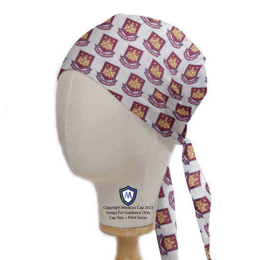 The Medicus Scrub Caps Football Club West Ham United scrub cap, featuring maroon and gold crossed hammers crests with West Ham United text, is stylishly tied at the back and ideal for healthcare professionals.