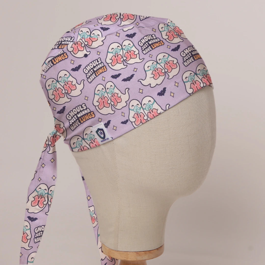 Ghouls Just Wanna Have Lungs scrub cap in Bandana tie-back style on mannequin head, front right view with the Medicus label