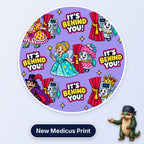 It's Behind You scrub cap print: pantomime characters with anaesthetic machines peeking from behind red curtains on lilac