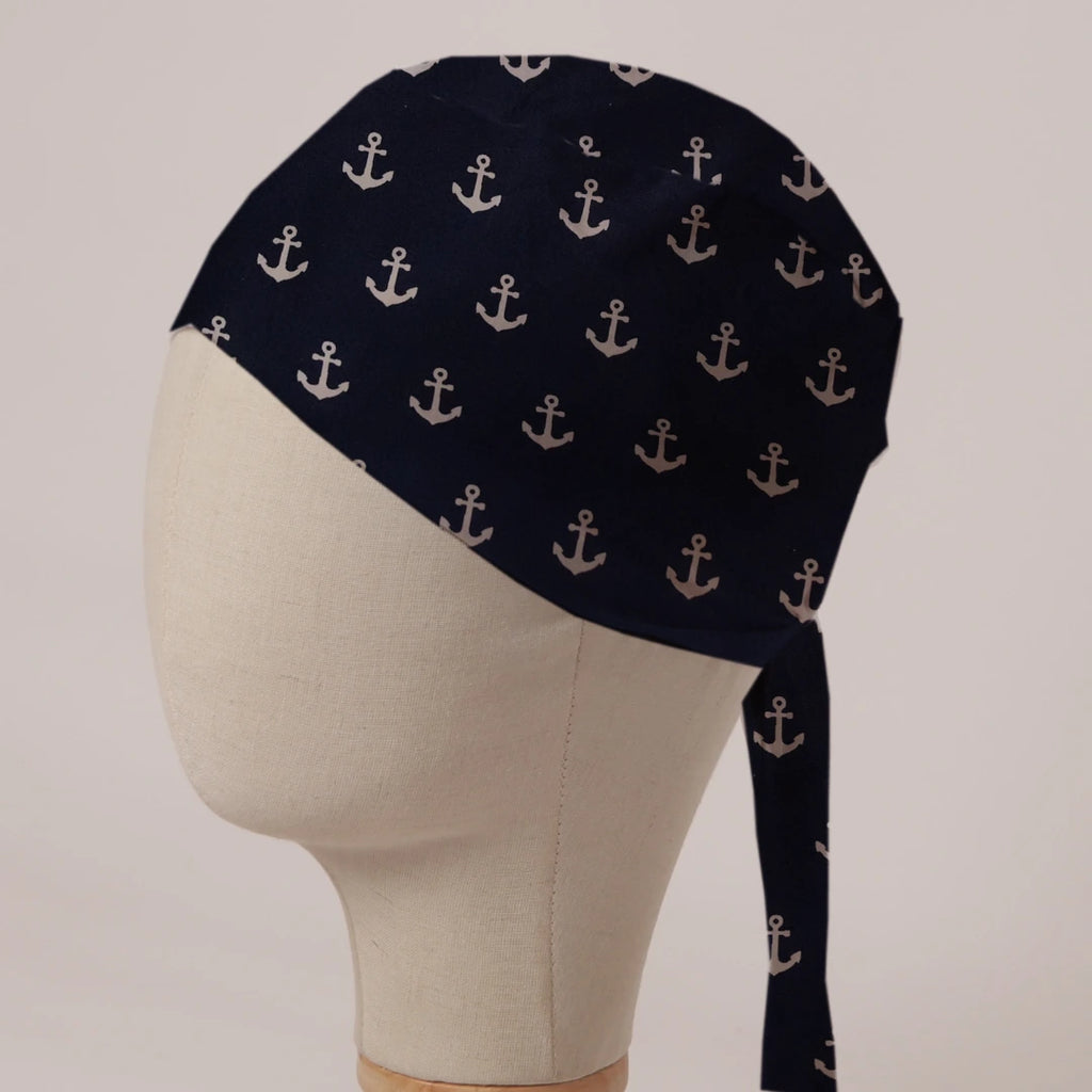 Larger Anchors On Navy scrub cap in Bandana tie-back style: large cream anchors on deep navy