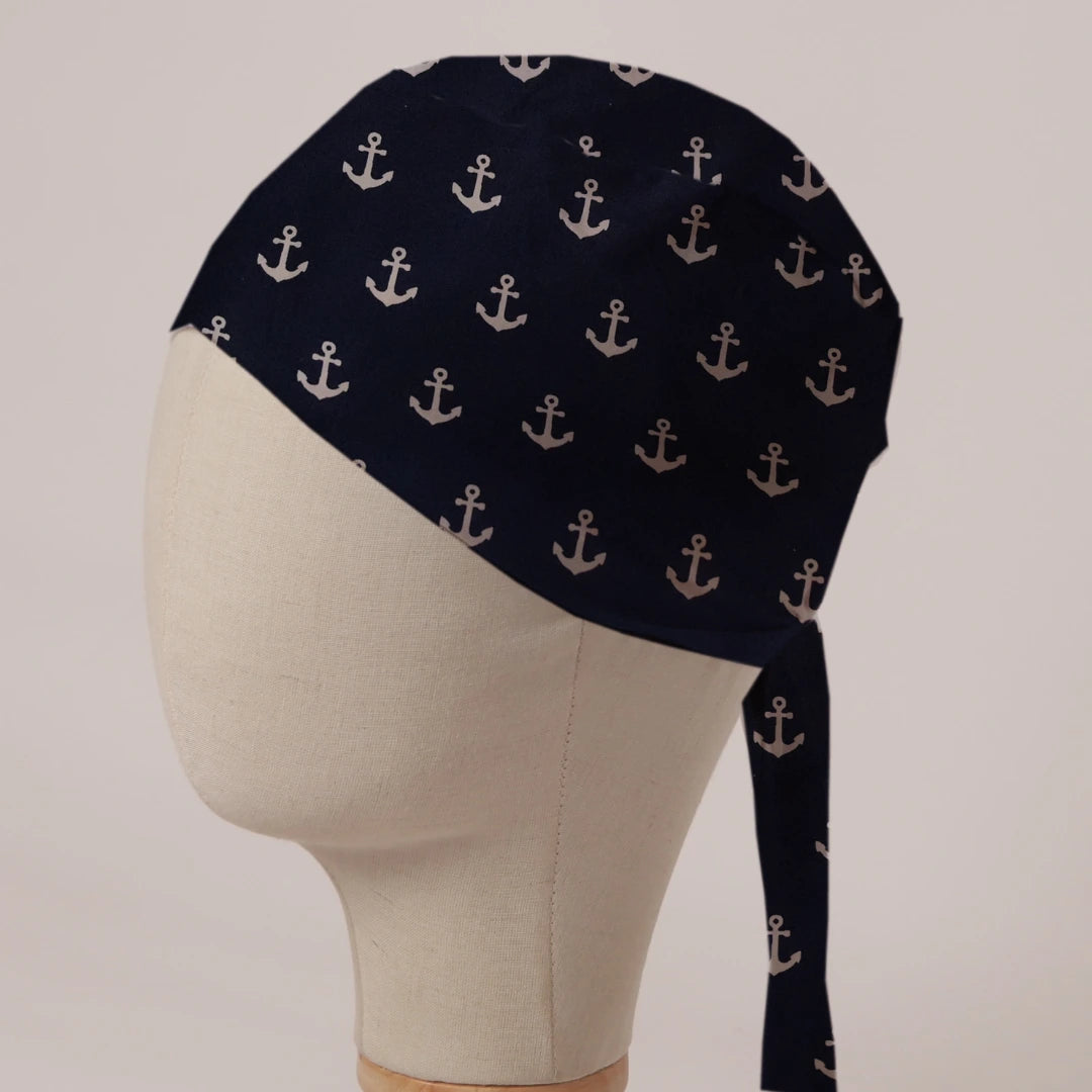 Larger Anchors On Navy scrub cap in Bandana tie-back style: large cream anchors on deep navy