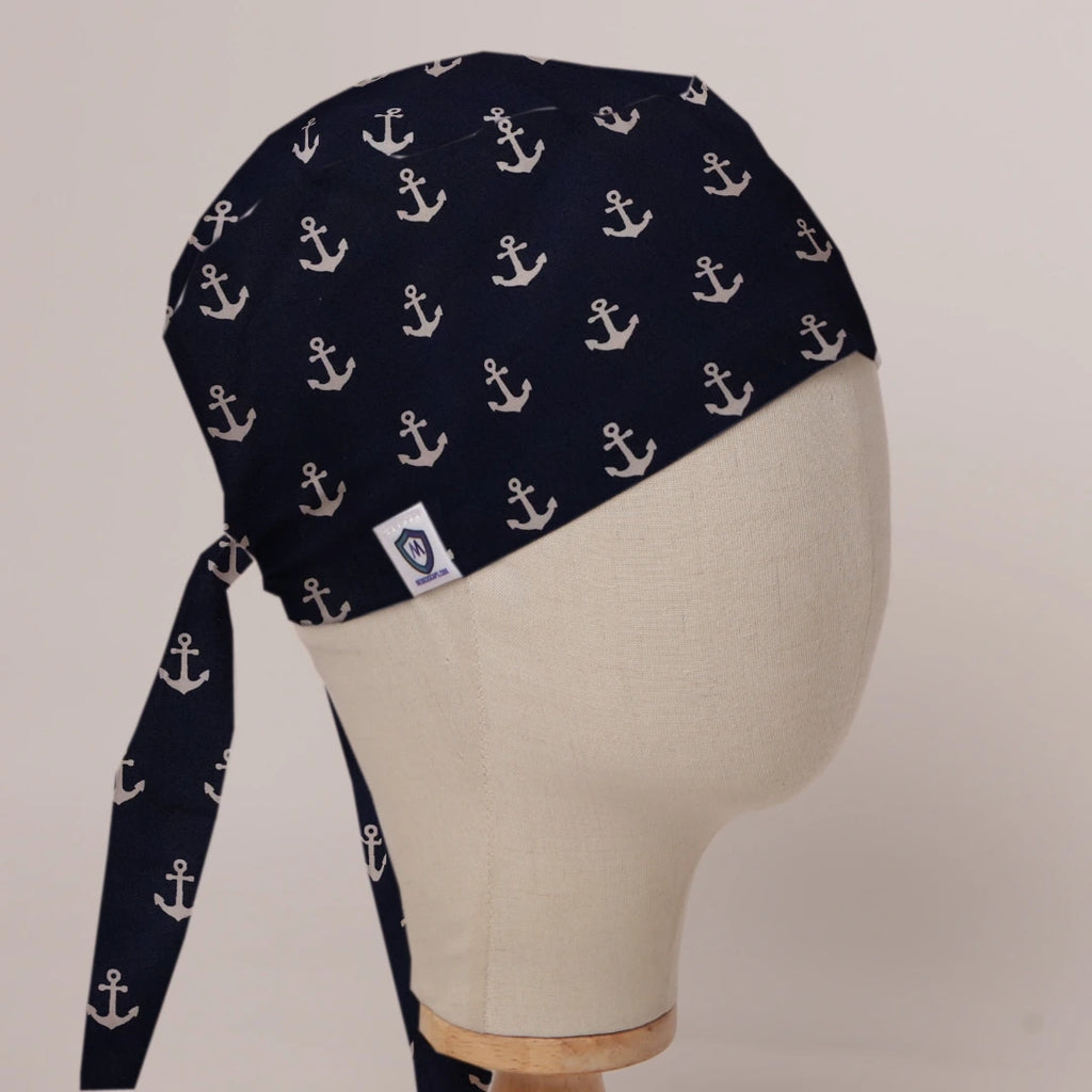 Larger Anchors On Navy scrub cap in Bandana tie-back style on mannequin head, front right view with the Medicus label