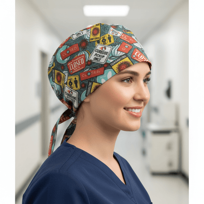 Vintage sign pattern scrub cap with red blue yellow designs and tie-back closure