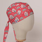 Merry Cystmas scrub cap in Bandana tie-back style on mannequin head, front right view with the Medicus label