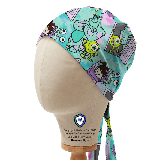 The Medicus Scrub Caps Monsters Inc Cartoon Kawaii Scrub Cap shown on a mannequin head, features lively cartoon monsters in green and purple with an M logo on the base.