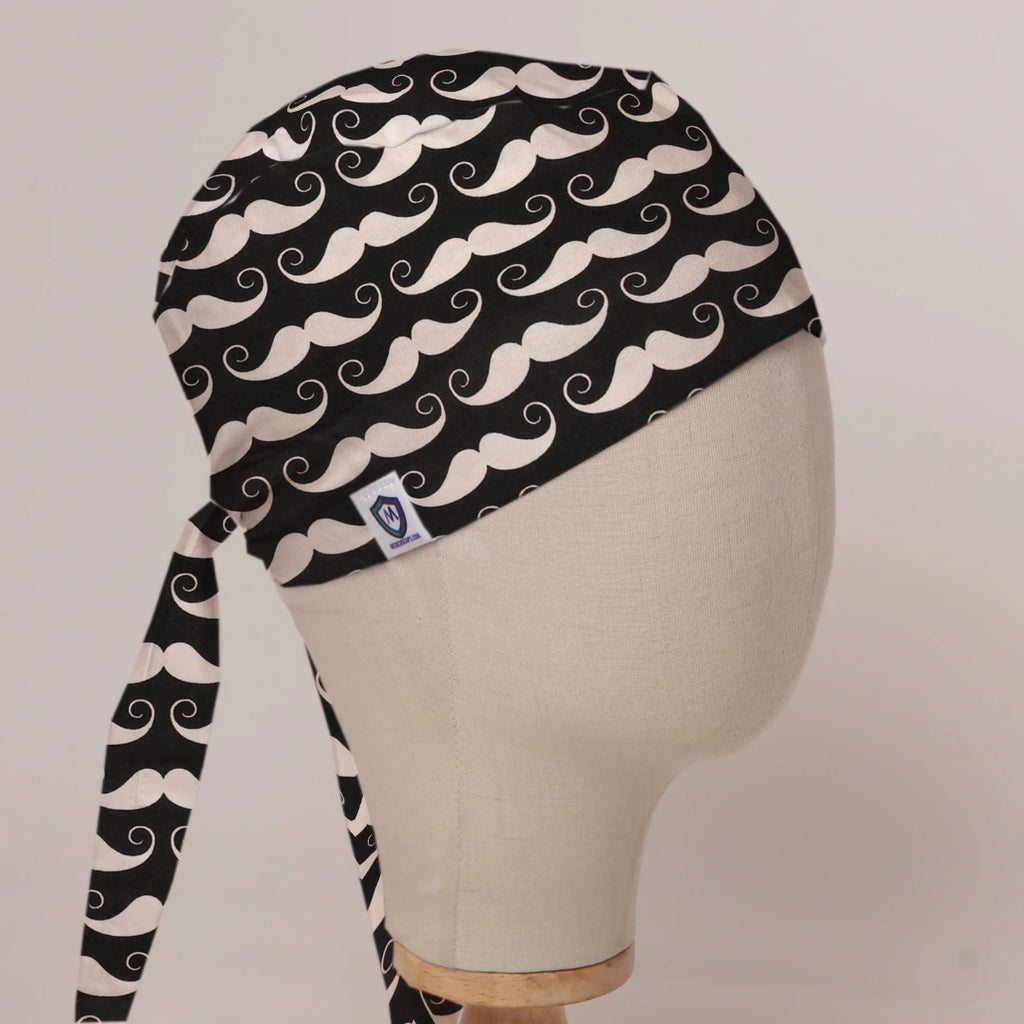 Moustaches On Black scrub cap in Bandana tie-back style on mannequin head, front right view with the Medicus label
