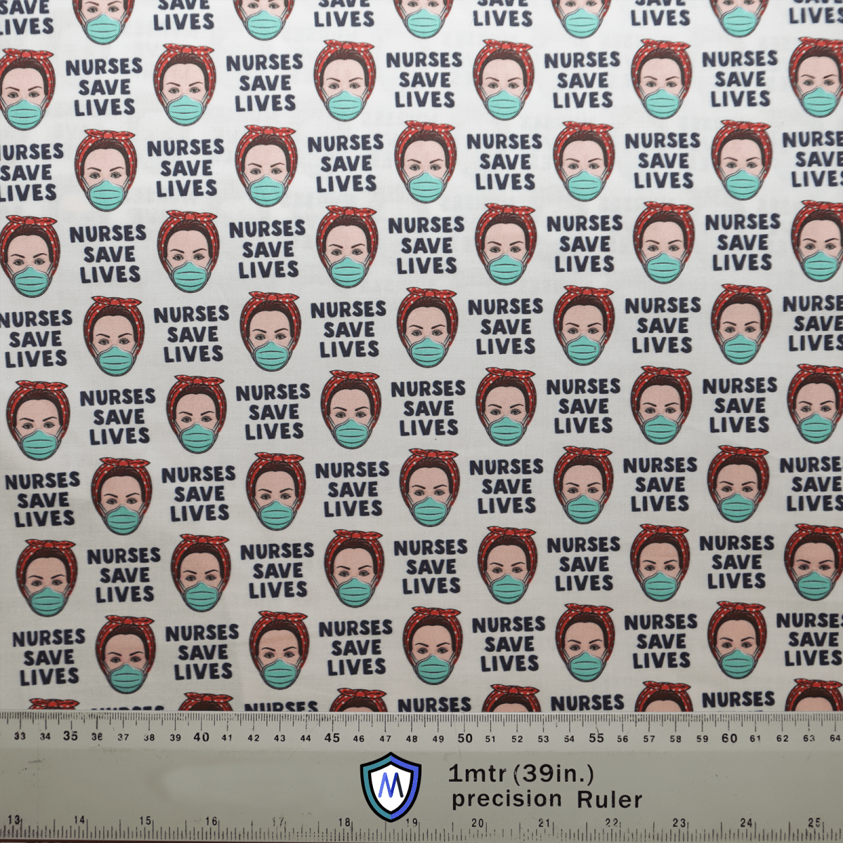 The fabric of the Medicus Scrub Caps product, Nurses Save Lives Scrub Cap, showcases a repeating design featuring nurses faces, some with masks and scrub caps, with NURSES SAVE LIVES text in black. A precision ruler at the bottom measures 1 meter (39 inches).