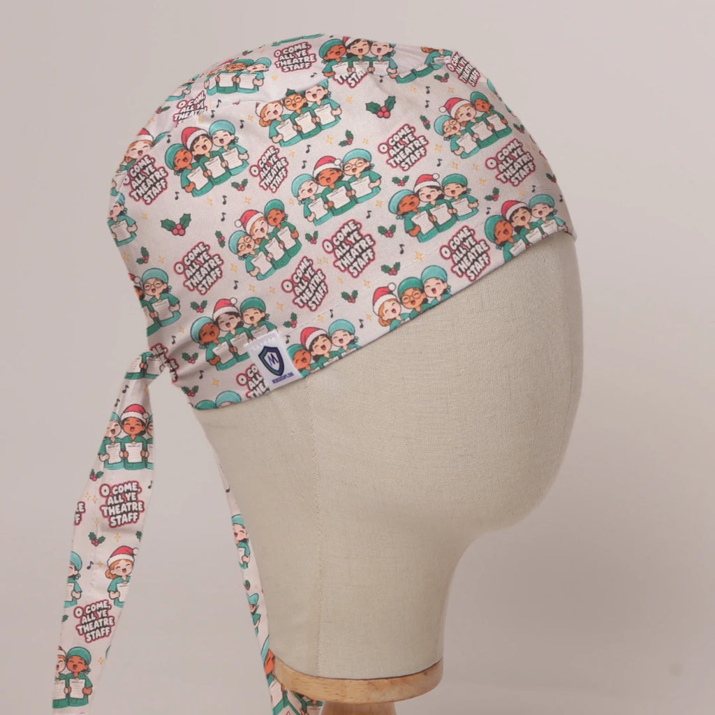O Come All Ye Theatre Staff scrub cap in Bandana tie-back style on mannequin head, front right view with the Medicus label