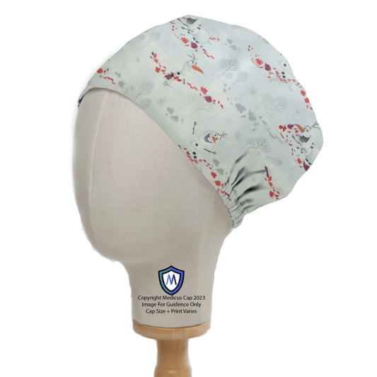 A mannequin displays the Olaf Frozen Scrub Cap from Medicus Scrub Caps, featuring a light blue base with red and blue floral patterns. The stylish cap provides comfort and has a small logo on the front, showing a shield with a blue M.