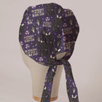 On Wednesdays We Wear Black Lead scrub cap in Bandana tie-back style on mannequin head, back view with ties