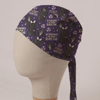 On Wednesdays We Wear Black Lead scrub cap: black lead aprons, hand X-rays and radiation symbols on deep purple