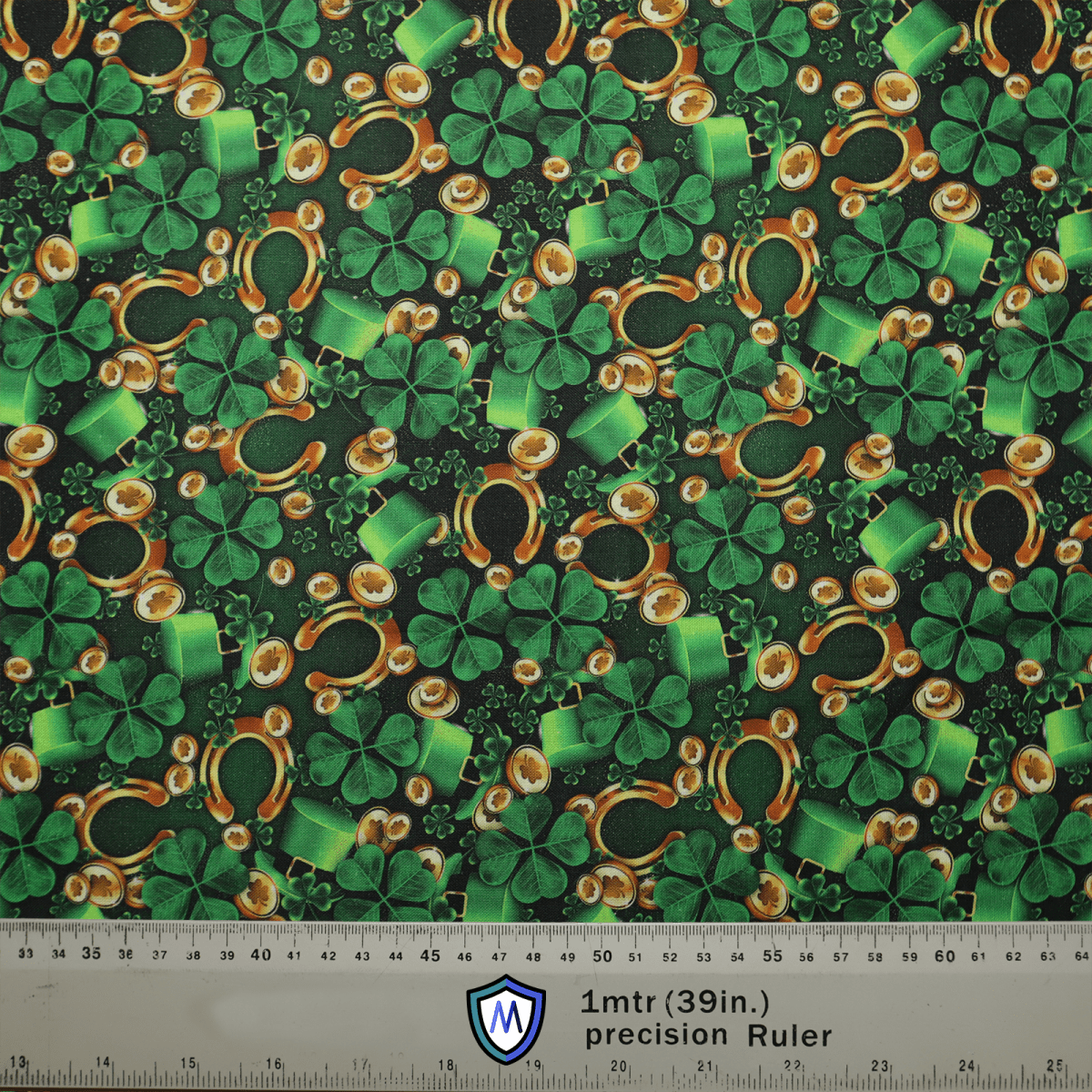 The Paddy Luck Of The Irish Scrub Cap by Medicus Scrub Caps features a lively pattern with green shamrocks, top hats, and golden coins on a dark background. It includes a 1mtr (39in) scale ruler at the bottom and a logo for comfort and sustainable fit.