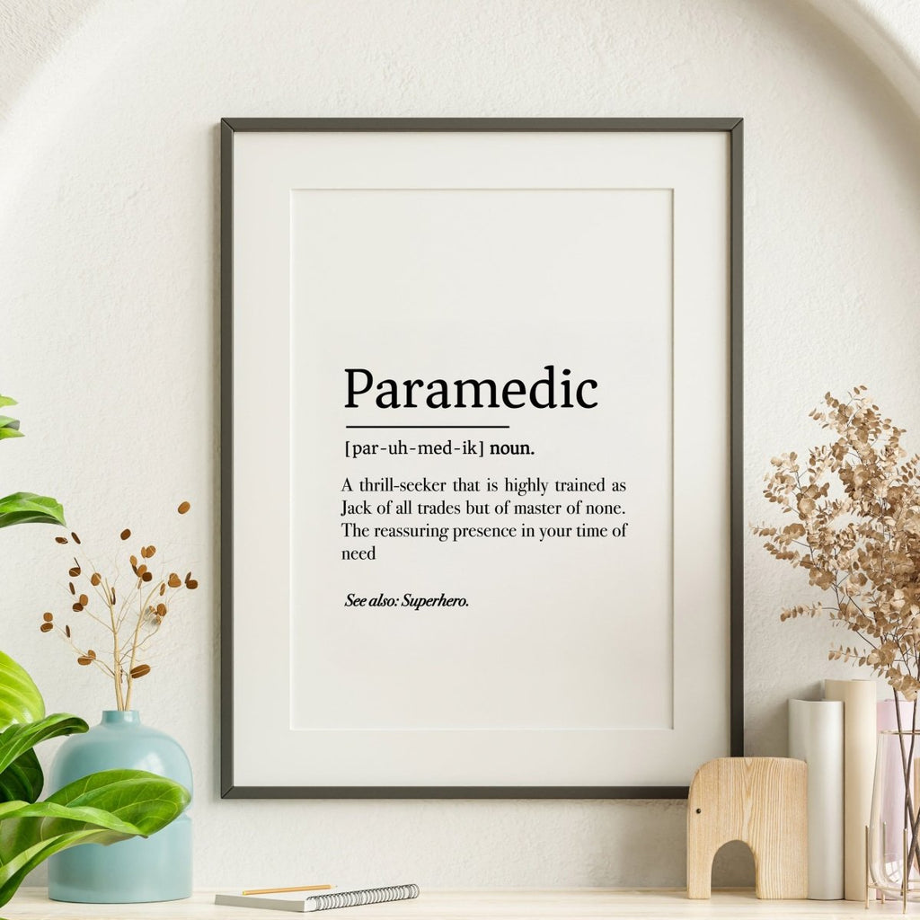 The Paramedic Definition Poster by Medicus Scrub Caps, a digital download in three styles, humorously defines paramedics. Perfect for modern shelf decor with plants.