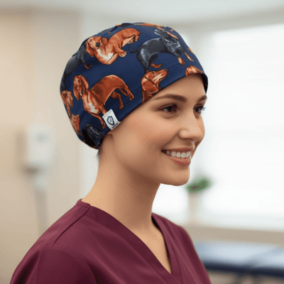 Navy blue scrub cap with orange and brown dachshund sausage dog pattern