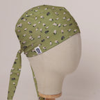 Sheep Fields scrub cap in Bandana tie-back style on mannequin head, front right view with the Medicus label