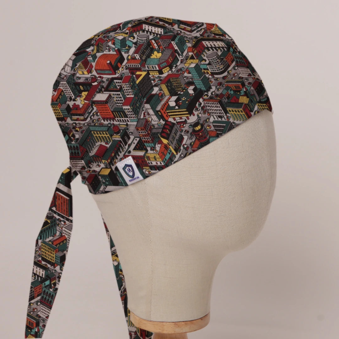 Sim City Inspired Isometric City scrub cap in Bandana tie-back style on mannequin head, front right view with the Medicus