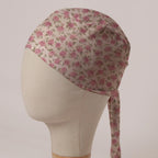 Small Roses On Beige scrub cap in Bandana tie-back style: small dusky pink roses on soft beige