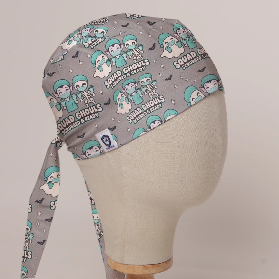 Squad Ghouls Scrubbed & Ready scrub cap in Bandana tie-back style on mannequin head, front right view with the Medicus label