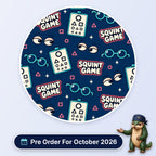 Squint Game scrub cap print: eye charts with shapes, glasses and squinting eyes on navy, with a Pre Order For October 2026 badge