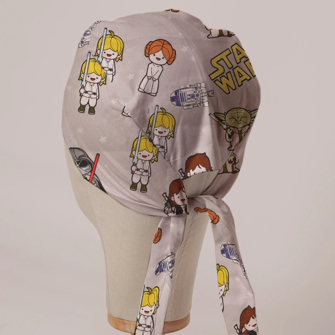 Star Wars Kawaii on Beige fabric scrub cap in Bandana tie-back style on mannequin head, back view with ties