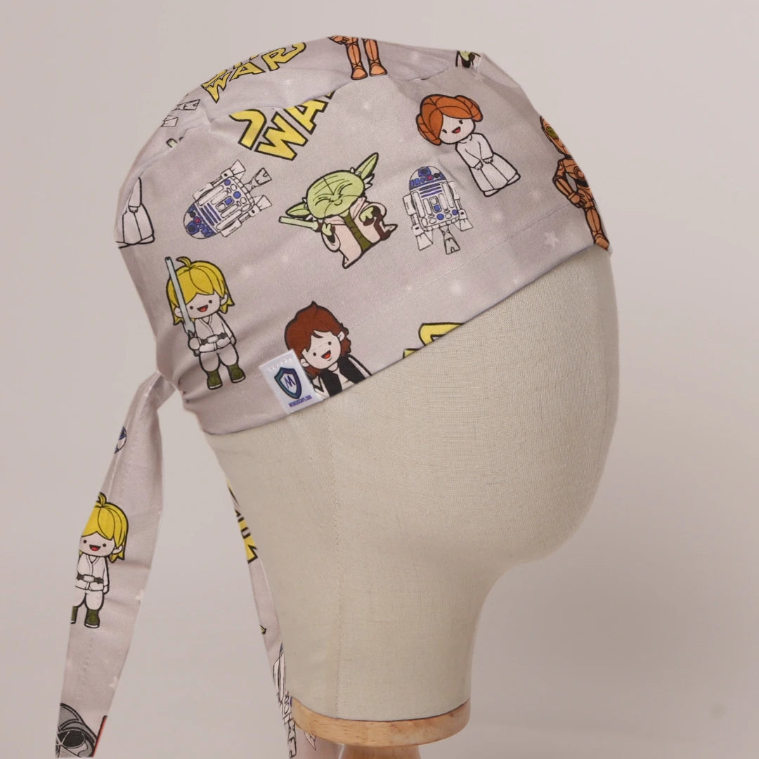 Star Wars Kawaii on Beige fabric scrub cap in Bandana tie-back style on mannequin head, front right view with the Medicus