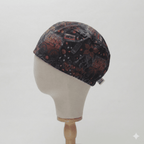 Dark patterned scrub cap with red and black icons displayed on white mannequin head, side view