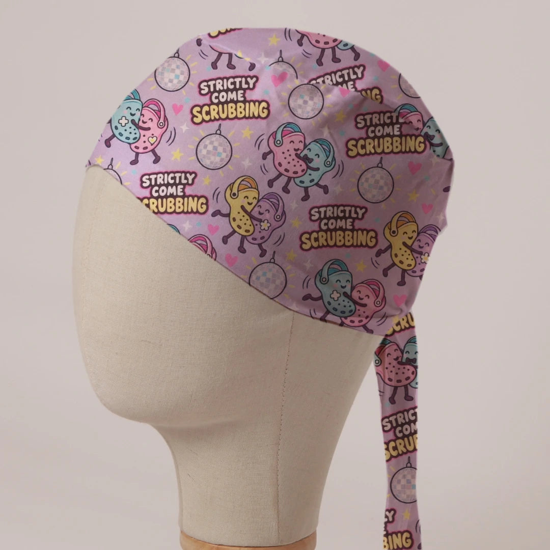 Strictly Come Scrubbing scrub cap in Bandana tie-back style: dancing theatre clogs under glitter balls on lilac