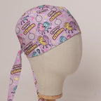 Strictly Come Scrubbing scrub cap in Bandana tie-back style on mannequin head, front right view with the Medicus label