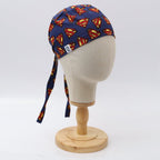 Side view of Superman logo scrub cap on navy background displayed on mannequin head