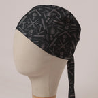 Surgeon Barbershop scrub cap in Bandana tie-back style: straight razors, scissors, combs and barber poles in grey on charcoal