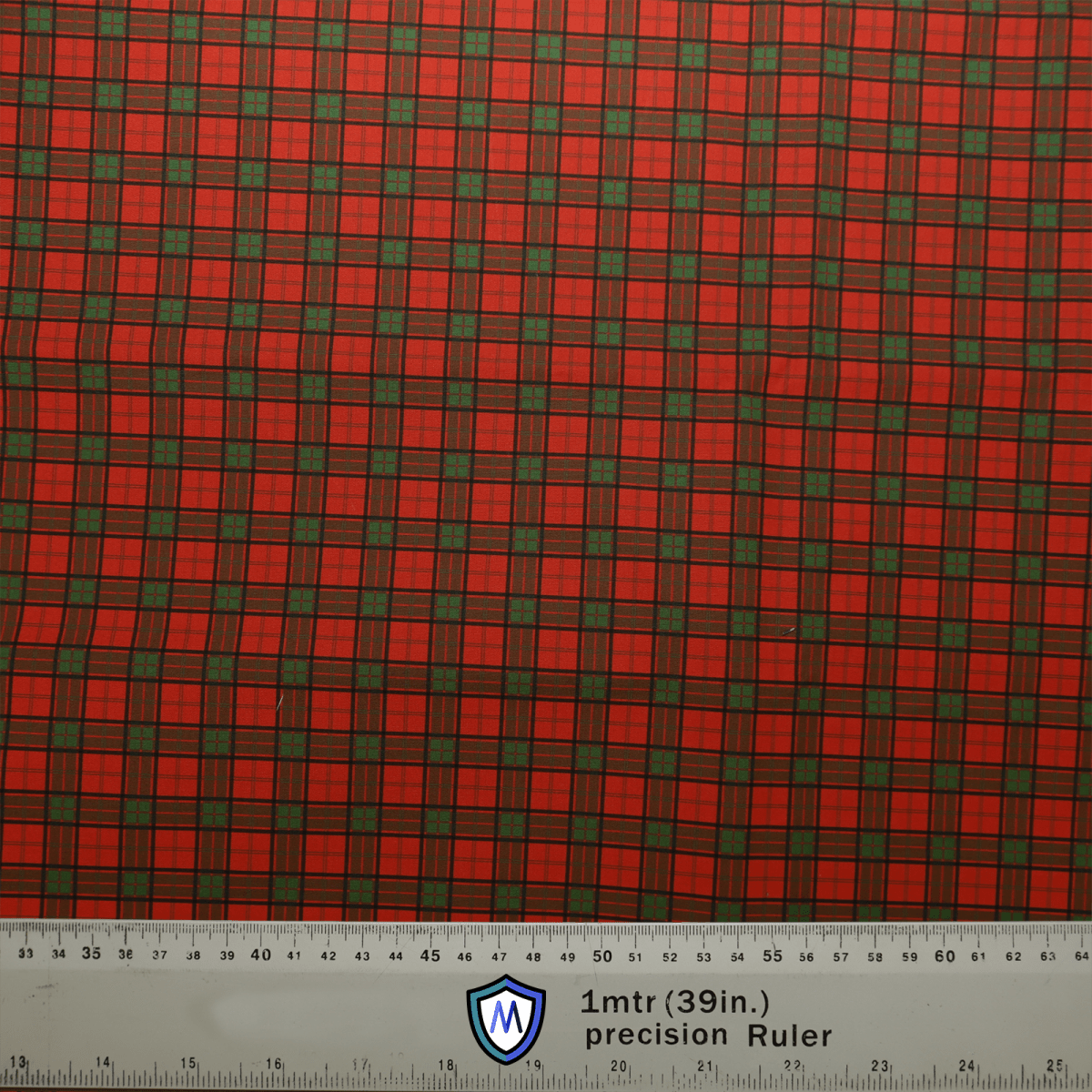 A Tartan Scottish Red Green Scrub Cap by Medicus Scrub Caps features a red and green plaid reminiscent of Scottish heritage, with a white ruler at the bottom showing measurements in centimeters and inches, labeled 1mtr (39in.) precision Ruler.