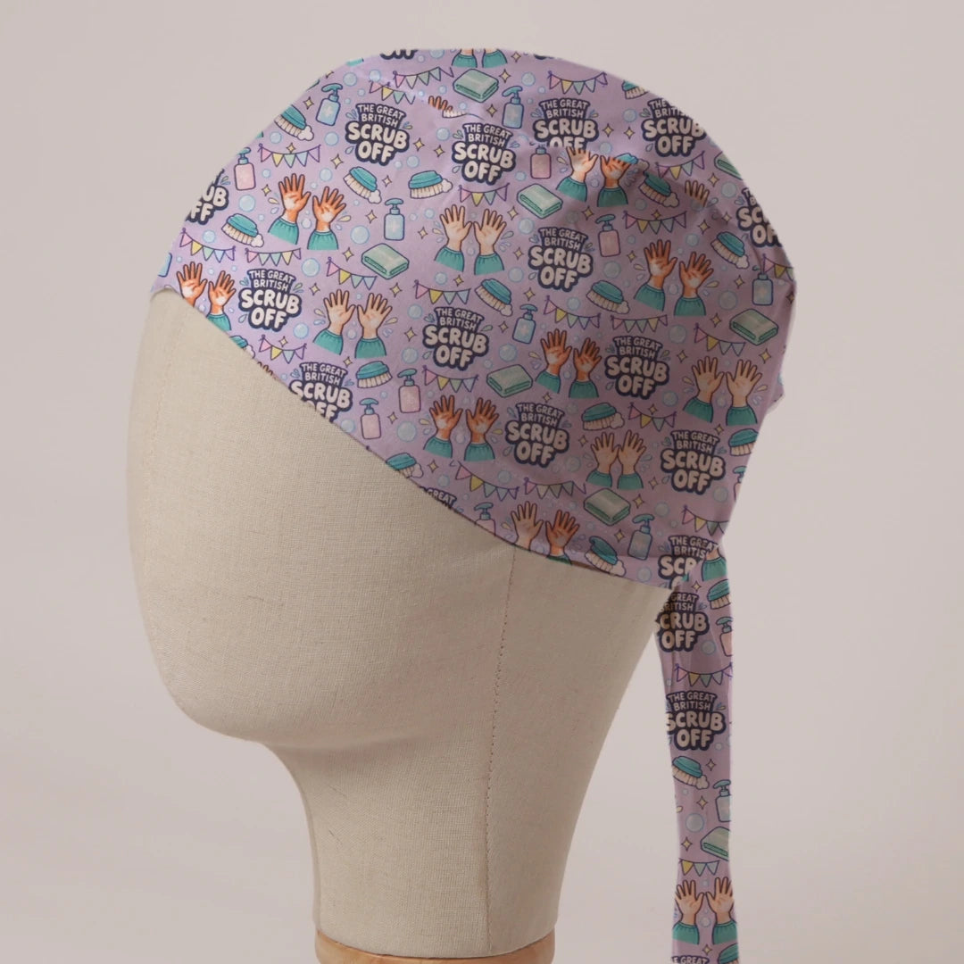 The Great British Scrub Off scrub cap in Bandana tie-back style: scrubbed hands, soap, nail brushes and bunting on lilac